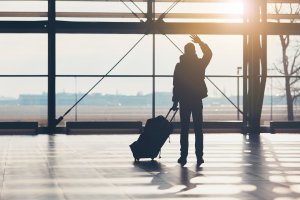 Airport Transfers Gold Coast and Brisbane QLD man waving at airport